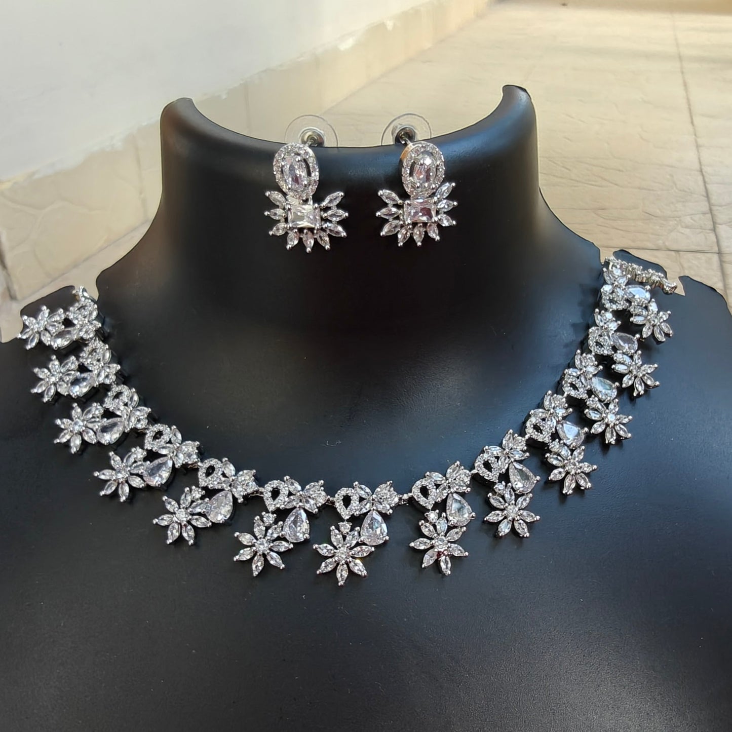 Flower design necklace with studs