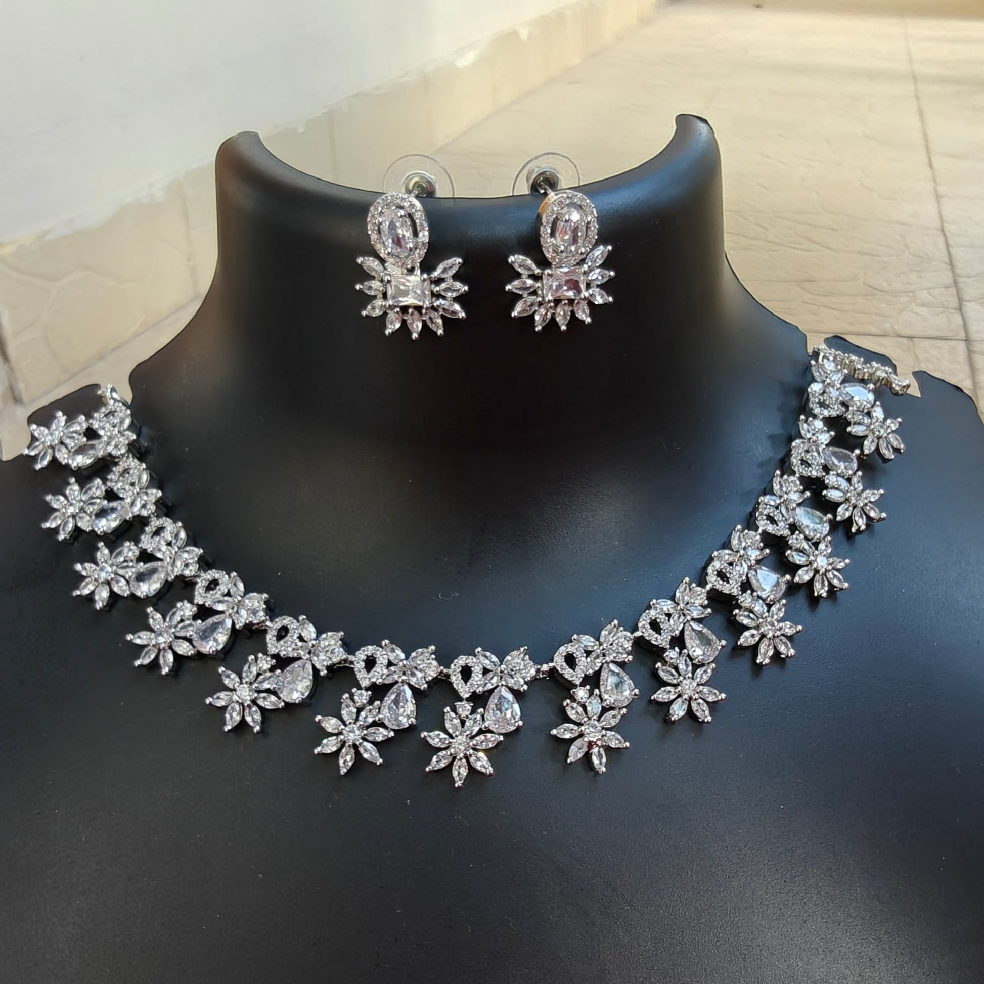 Flower design necklace with studs